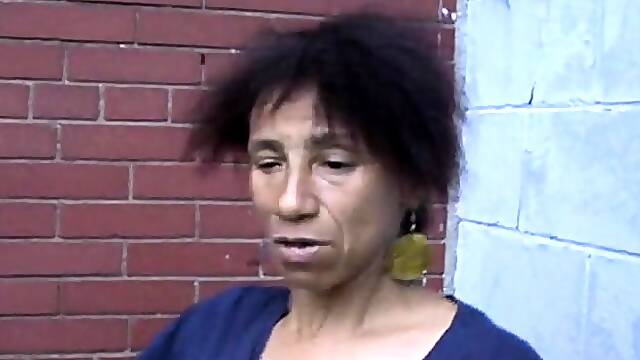 Nasty black lady drops her pants and reveals her hairy cunt